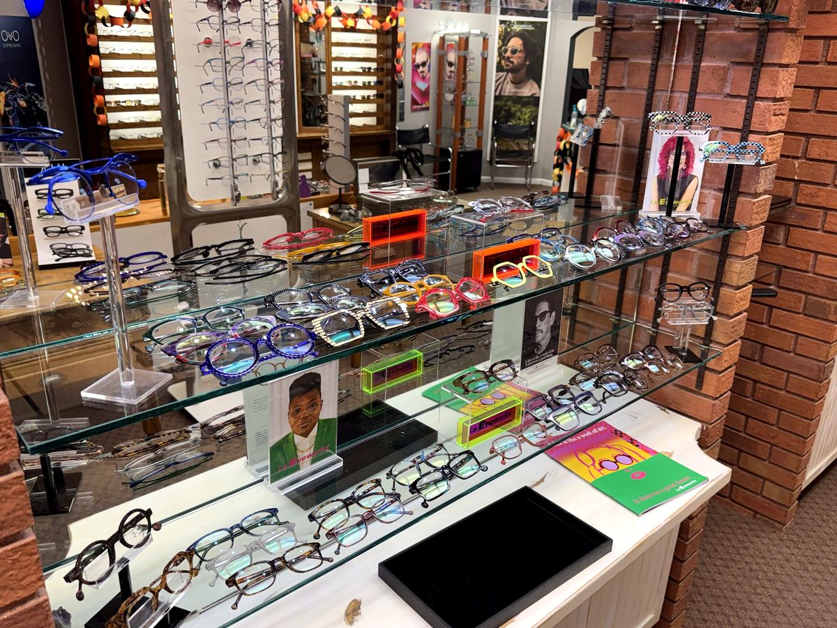 Colorful frame displays and the frame wall inside The Optical Centre's optical boutique
