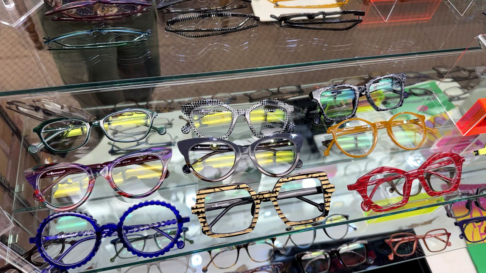 Shelves of colorful frames in bold shapes and patterns at The Optical Centre