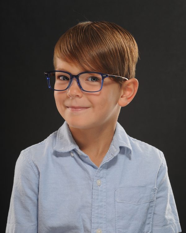 A patient of The Optical Centre in their glasses