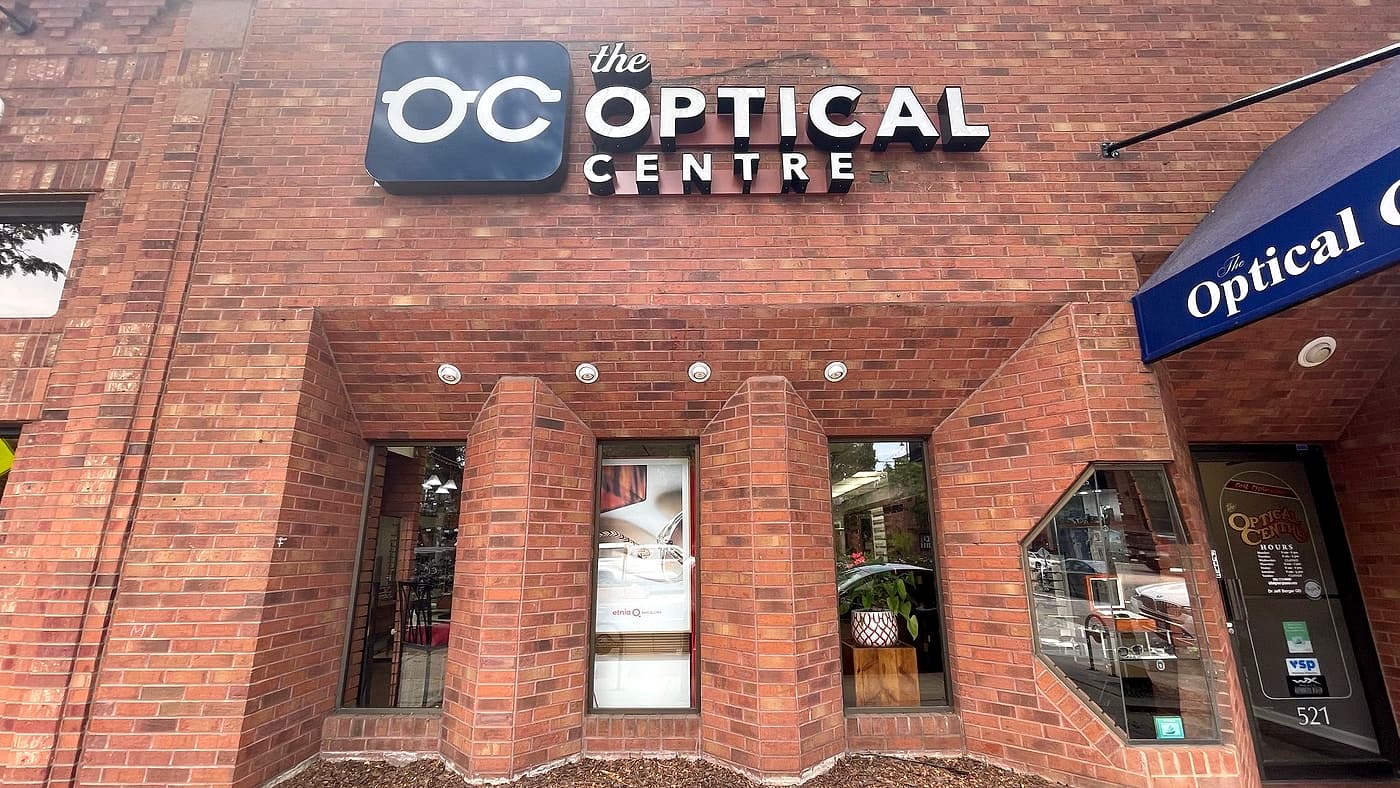 The front of The Optical Centre at 521 Main Street, with the entrance under the blue awning